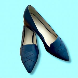Call Haan flats with 1.5 inch heel.